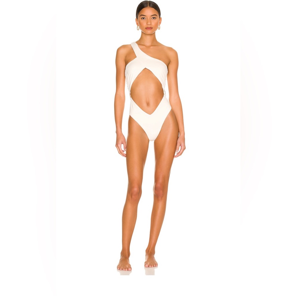 Asymmetrical crossover one piece. Off white color. Size medium